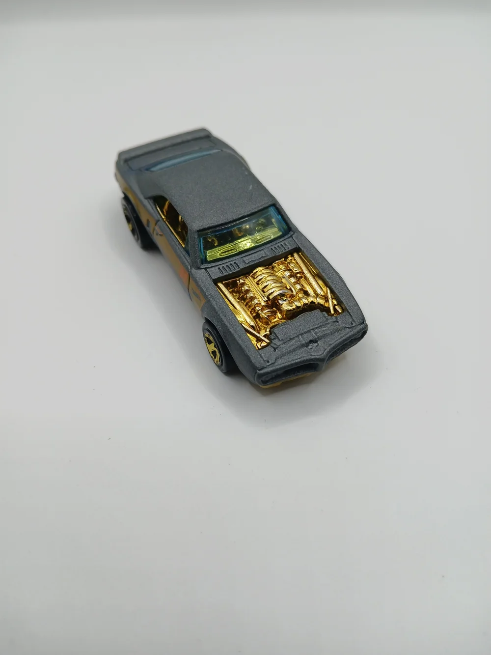 Gray Toy Muscle Car with Gold Engine Detail